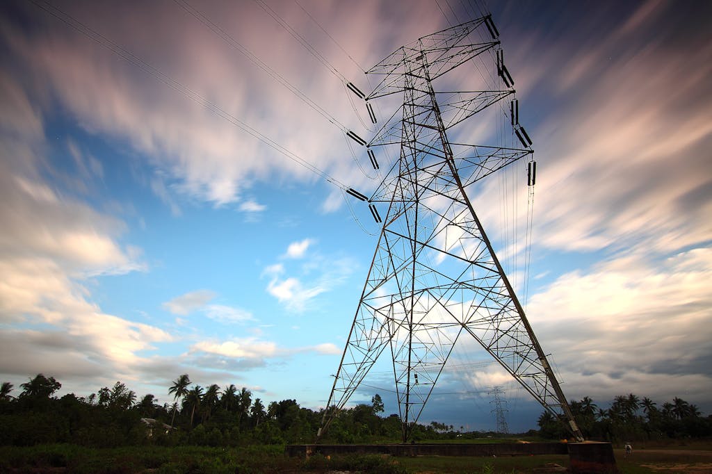 Stunning view of a towering power line against a vibrant sky, showcasing energy infrastructure in nature.